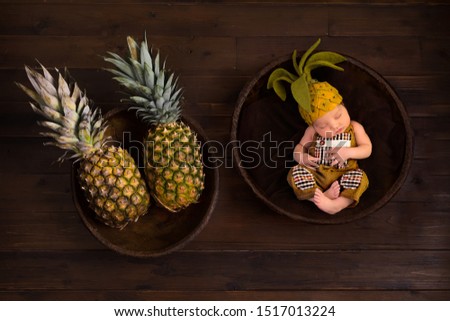 Cute composite image with fresh pineapples and a newborn baby in felted pineapple hat