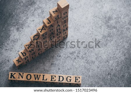 Cube letter of wording of knowledge, educated, passion, wisdom, learn, goal, aim, and do with copy space. Photo concept of business, idea and creativity, education, self learning and training.