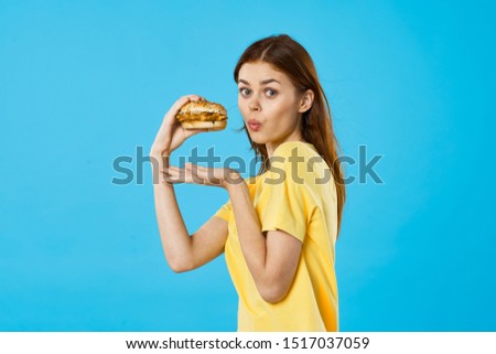 Beautiful woman hamburger fast food snacking breakfast diet