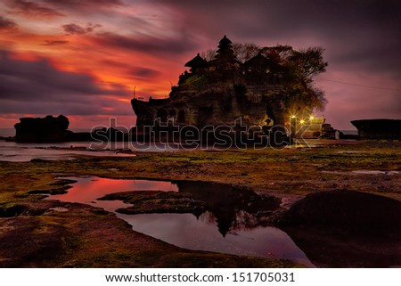 sunset over hindu temple Pura Tanah Lot, Bali, Indonesia Royalty-Free Stock Photo #151705031