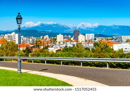 Picturesque cityscape of a European modern city with a beautiful mountain range in the background