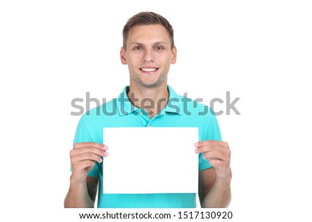 Young man with blank board on white background