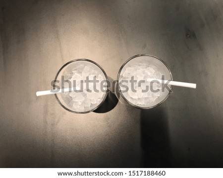 Ice glass placed on a classic black background.