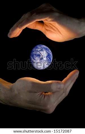 hands holding planet earth