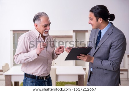 Male real estate agent and male client in the apartment