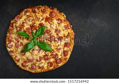 pizza with salami, sausage and cheese (delicious snack) menu concept. food background. copy space. Top viev