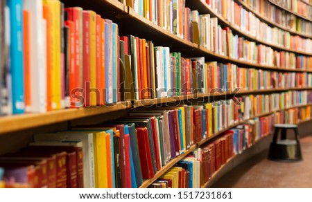 Library with many shelves and books, diminishing perspective and shallow dof