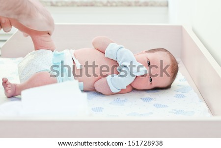 newborn baby in maternity hospital looking at the camera Royalty-Free Stock Photo #151728938