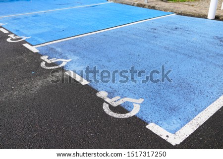 Disabled blue parking place for handicapped person