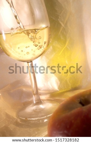 Glass of white wine, apple