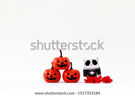  Orange pumpkin and skeleton paper with white background 