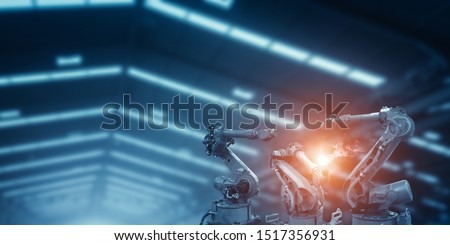 Automatic welding robot mechanical arm is working in the modern automobile parts factory. Royalty-Free Stock Photo #1517356931