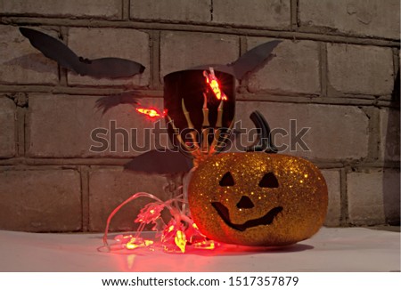 holidays image of halloween. happy halloween, holiday Halloween, pumpkin with eyes and glass with hand