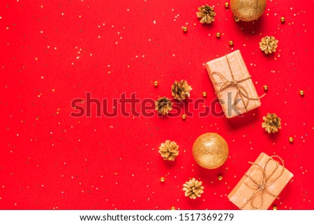 Christmas composition on a red background. Flat lay, top view, copy space