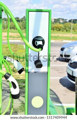 modern electric car charging station in a supermarket parking lot