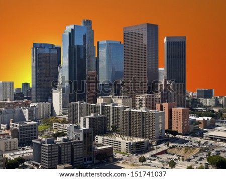 Downtown Los Angeles with orange sunset sky.  