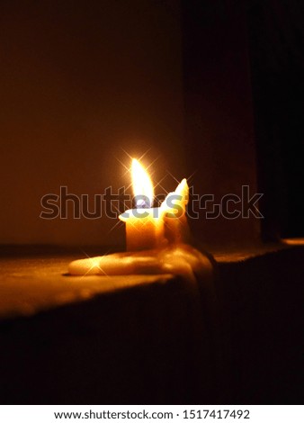 
candlelight in the dark of the night