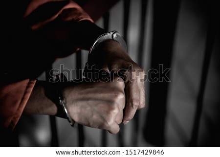 Hands of women desperate to catch the iron prison,prisoner concept,thailand people,Hope to be free,If the violate the law would be arrested and jailed. Royalty-Free Stock Photo #1517429846