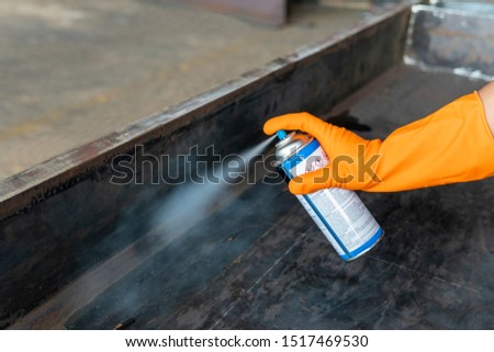 The step one and six of doing penetrant testing is step to use spray Solvent Remover to cleaning the welding surface before and after testing for Non-Destructive Testing with process Penetrant Testing Royalty-Free Stock Photo #1517469530