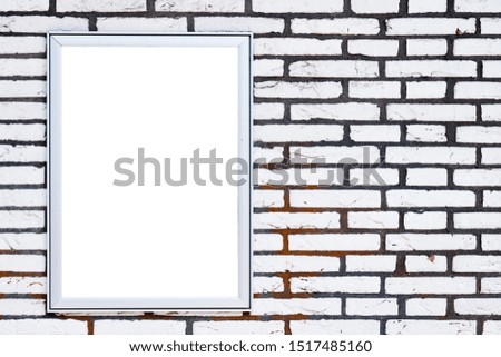 Blank poster board on the white bricks wall