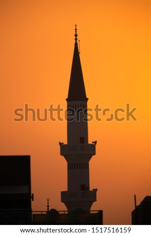 Minaret at sunrise a view from Busiateen coast, Bahrain 
