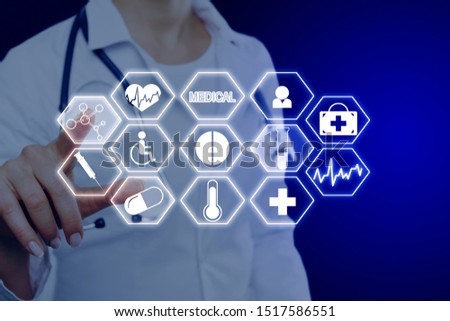 Female doctor using creative medical interface on blue background. Medicine and touchscreen concept. Double exposure