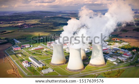 Aerial view to Temelin nuclear power plant.  This power station is important source of electricity for Czech Republic in European Union. Warm filtered photography. Royalty-Free Stock Photo #1517639576