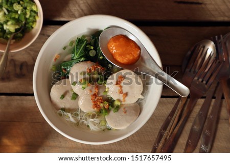 Bakso Sapi Gepeng. Popular street food dish of flat meatball soup with rice noodles.