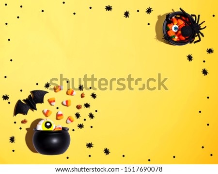Halloween decorations with witch cauldron - overhead view flat lay