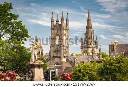 Statue of Edward VII with Former South Church with Kirk of St Nicholas (Triple Kirk) in the background, in Aberdeen, Scotland, UK Royalty-Free Stock Photo #1517692769