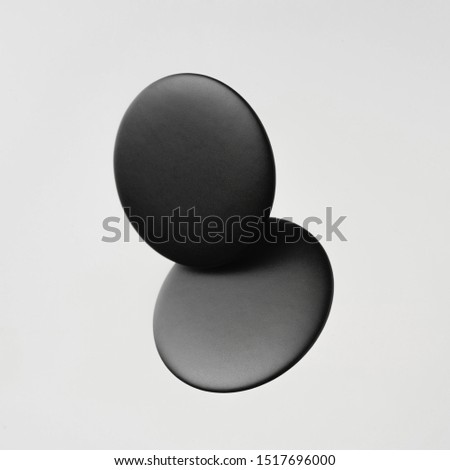 Design concept - top view of 2 black badge float on white background for mockup, it's real photo, not 3D render
