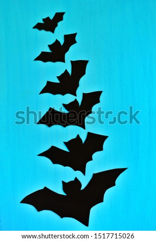 Top view Happy halloween holiday concept. Halloween decorations bats on blue background. Halloween party greeting card mockup with copy space.