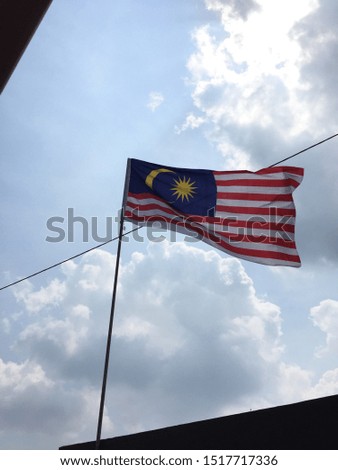 Malaysia flag blown away by wind