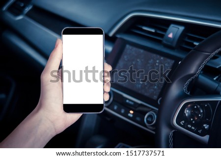 hand man holding use smartphone new model, For searching for directions, travel, in the latest car models.Concept of using a car phone For convenience and reduce accidents.blank screen