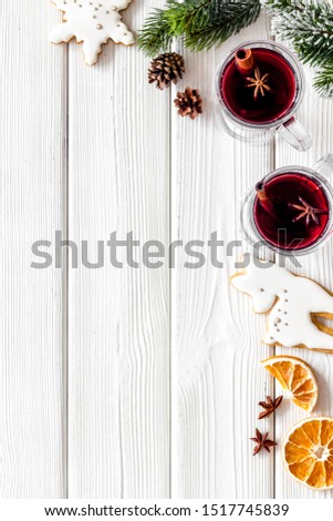 Background with mulled wine and New Year decoration on white wooden background top view frame copy space