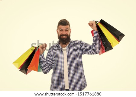 Bearded man with shopping bags.. Mature happy hipster with beard. Shopping sale. Male barber care. brutal caucasian hipster with moustache. Black Friday. Cyber Monday. Heavy bags.