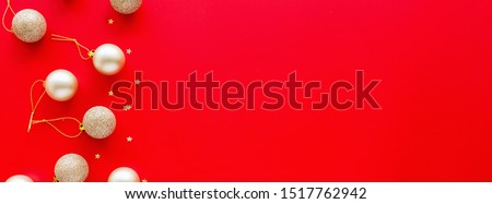 Christmas tree golden toys lying on red background. new year concept. Horizontal long banner for web design. Greeting card, xmas celebration 2020. Flat lay, top view, copy space, mock up, template