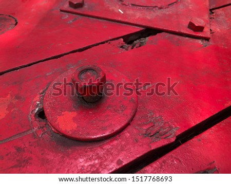 old red floor boards with screws