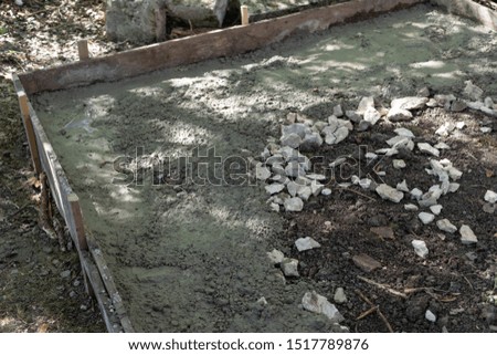 Picture of pouring concrete on a formwork floor at a building site