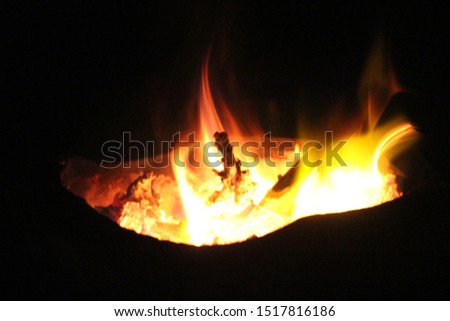 The fire in the energy burner that is burning on a black background