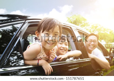 happy little girl with family sitting in the car  Royalty-Free Stock Photo #151787651