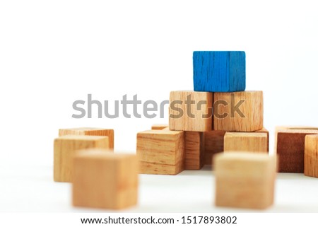 Square wood of different colors from the concepts of differentiation, leadership, abstract success
