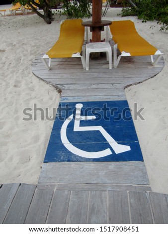 Sandy beach with disabled access and sunbeds