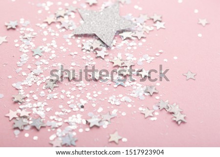 pink background with shiny glitter. silver stars.