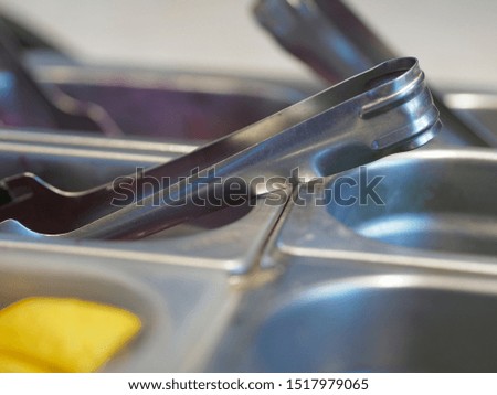 various kitchen utensils with lemon and colours