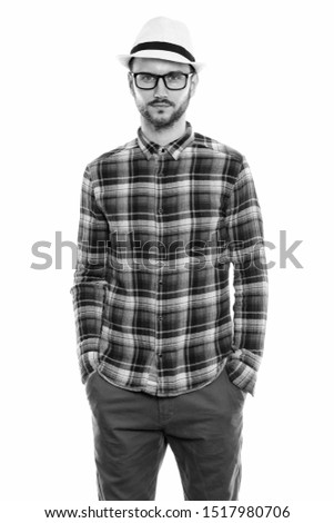 Studio portrait of young handsome man shot in black and white