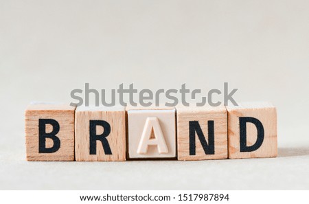 word BRAND on wooden cube block
