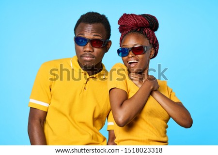 3D virtual reality glasses young people friends woman and man African American yellow t-shirt