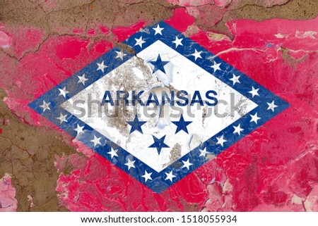 Arkansas grunge, damaged, scratch, old style state flag on wall.