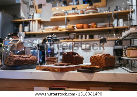 Cake shop, cafe or coffee shop with christmas chocolate or fruit cakes on the table. Winter cakes in cafe or coffeeshop. Royalty-Free Stock Photo #1518061490